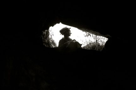 Caver at entrance, NSW
